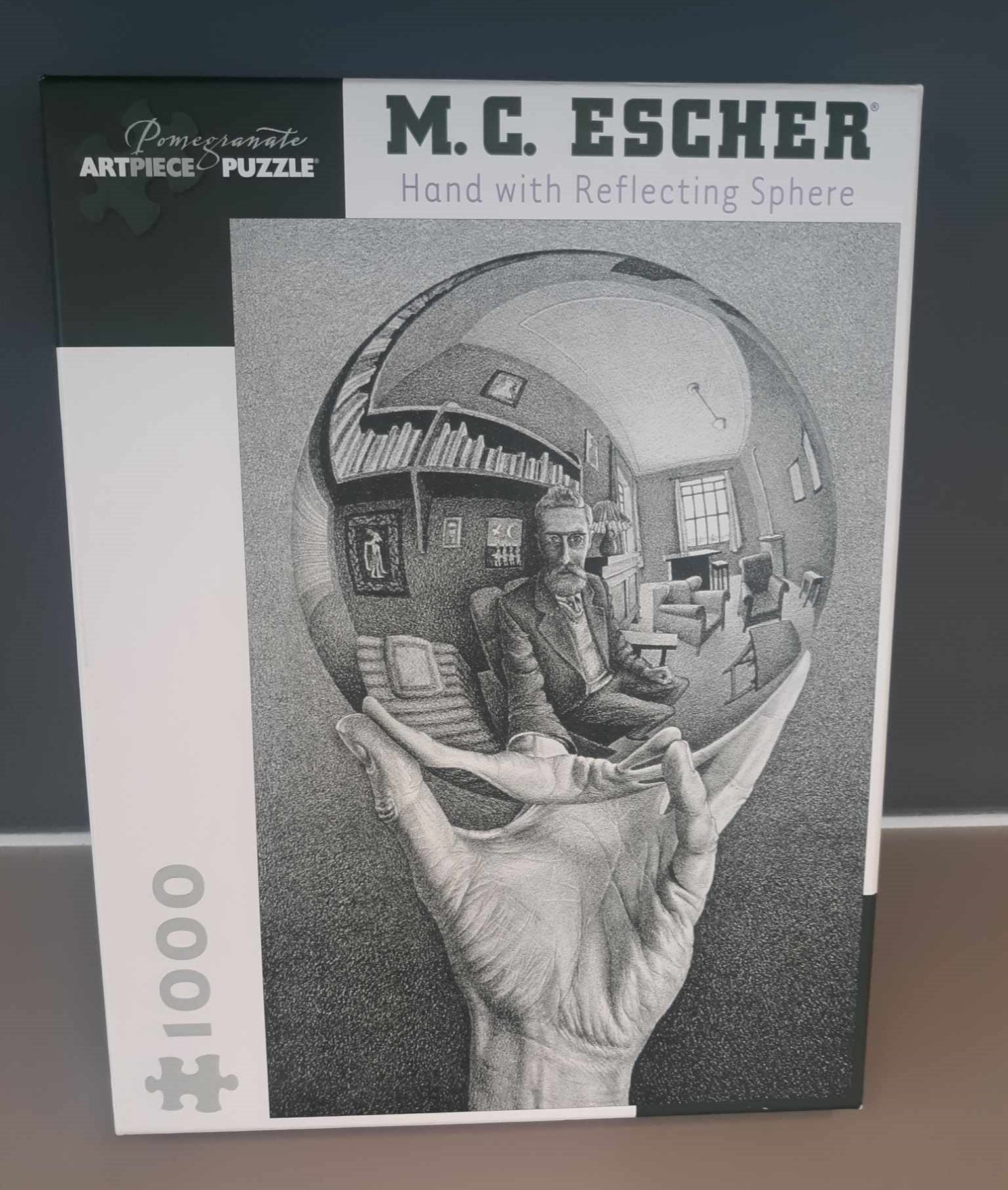 Cover image of puzzle, hand with reflecting sphere