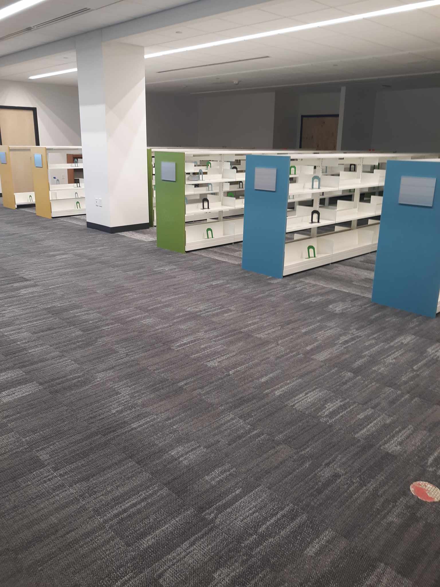 Empty shelves in the new Children’s Services department ready for material.