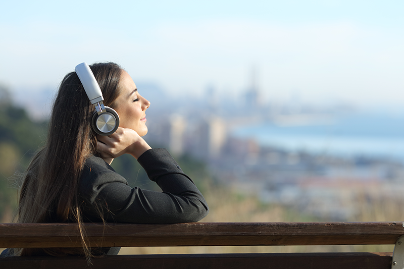 Woman listening to audiobooks with her headphones