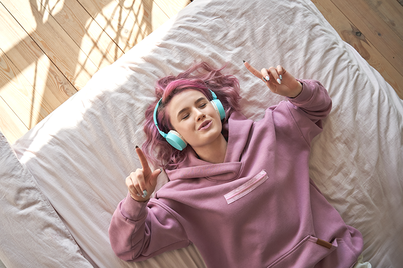 Woman listening to music CD