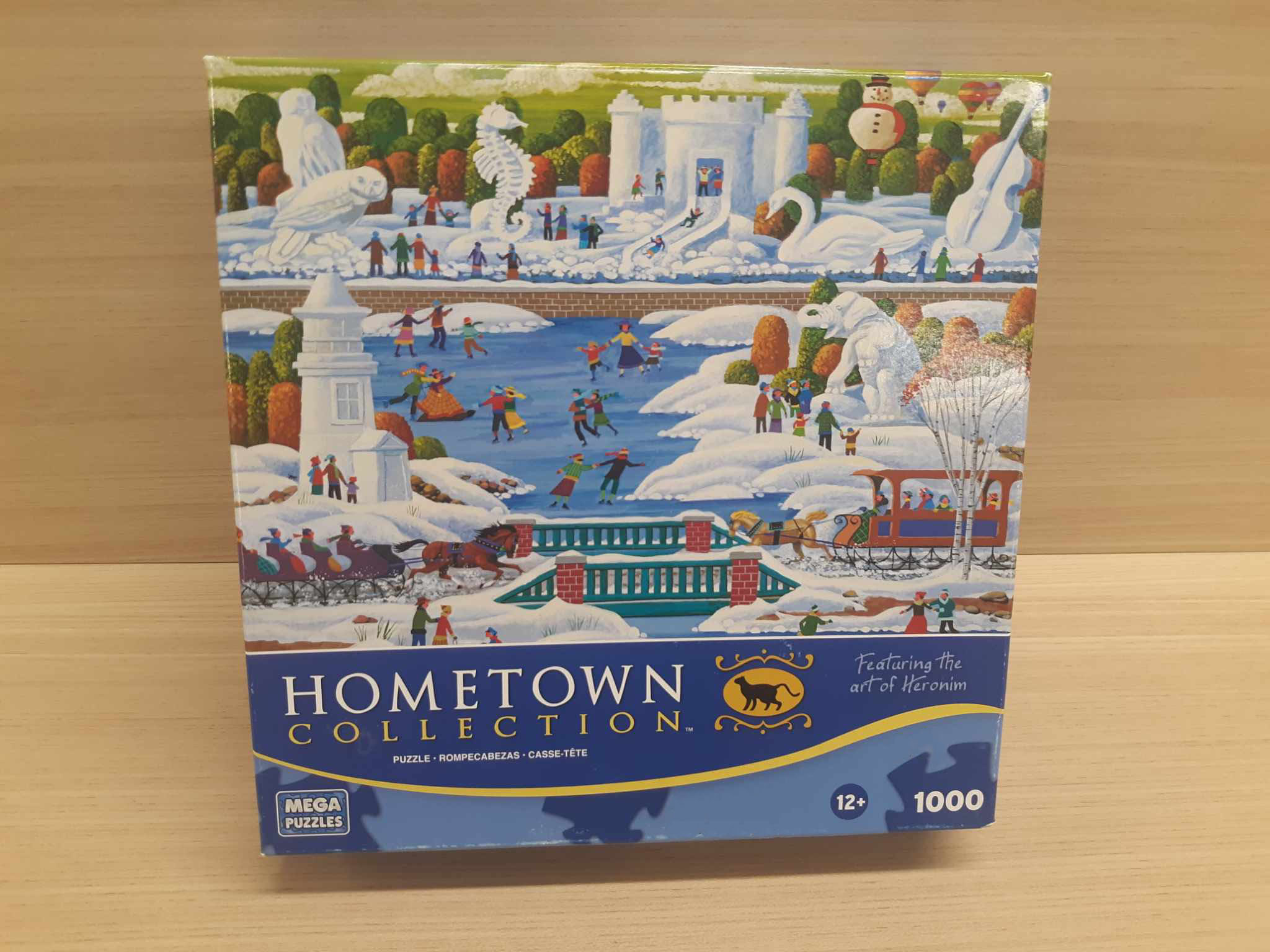 Image of a puzzle cover showing a frozen lake with ice skaters dancing around.