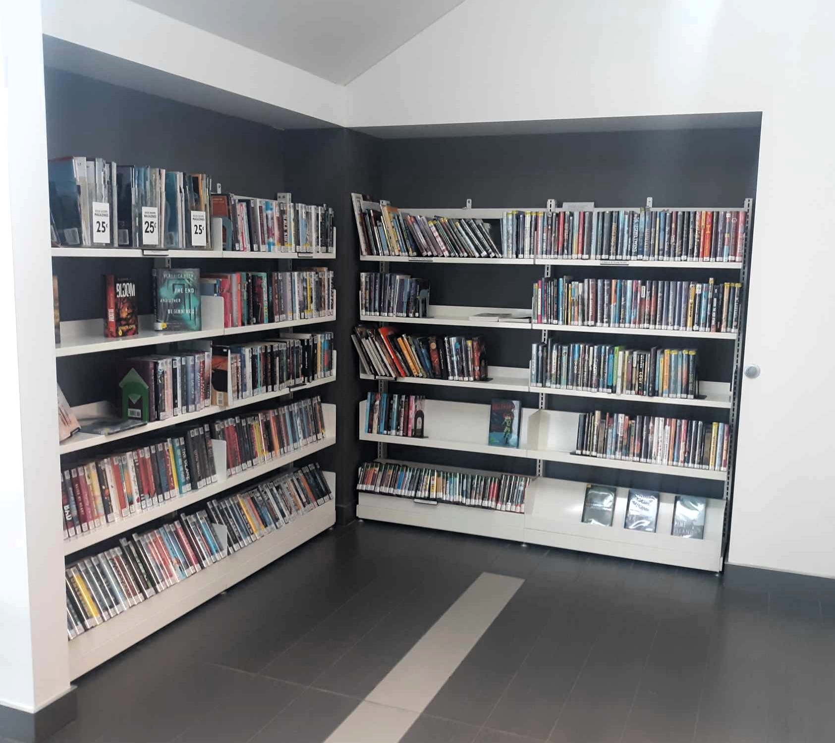 Book Shop shelves located underneath the stairs on the first floor.