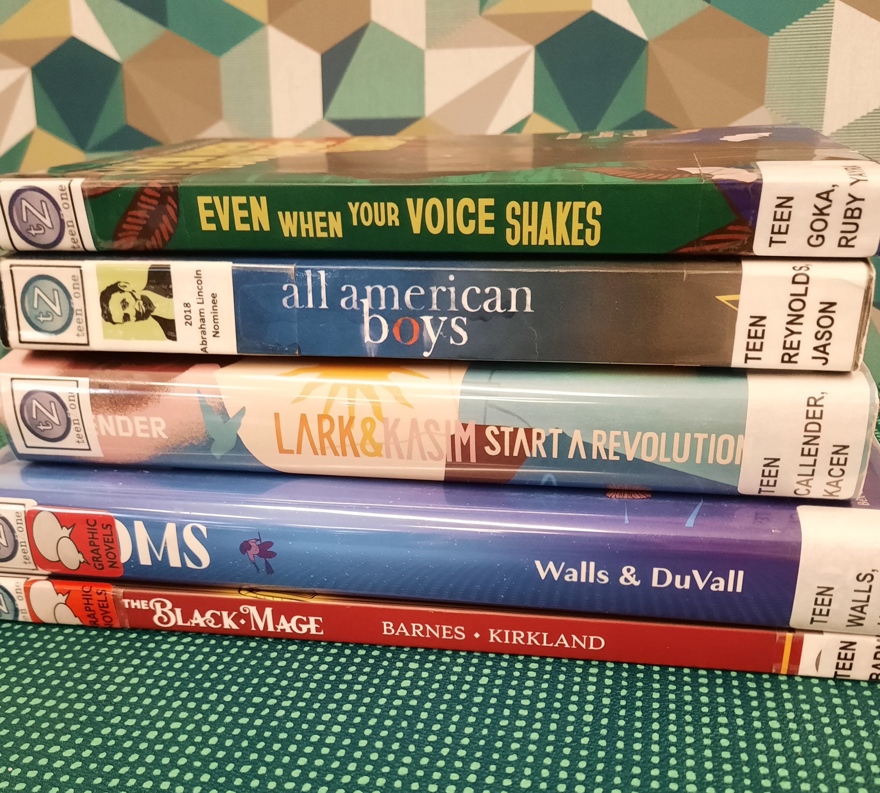 2025 February Book Stack Book stack showing the following books: "The Black Mage," "Brooms" "Lark & Kasim Start a Revolution," "All American Boys," and "Even when your voice shakes"
