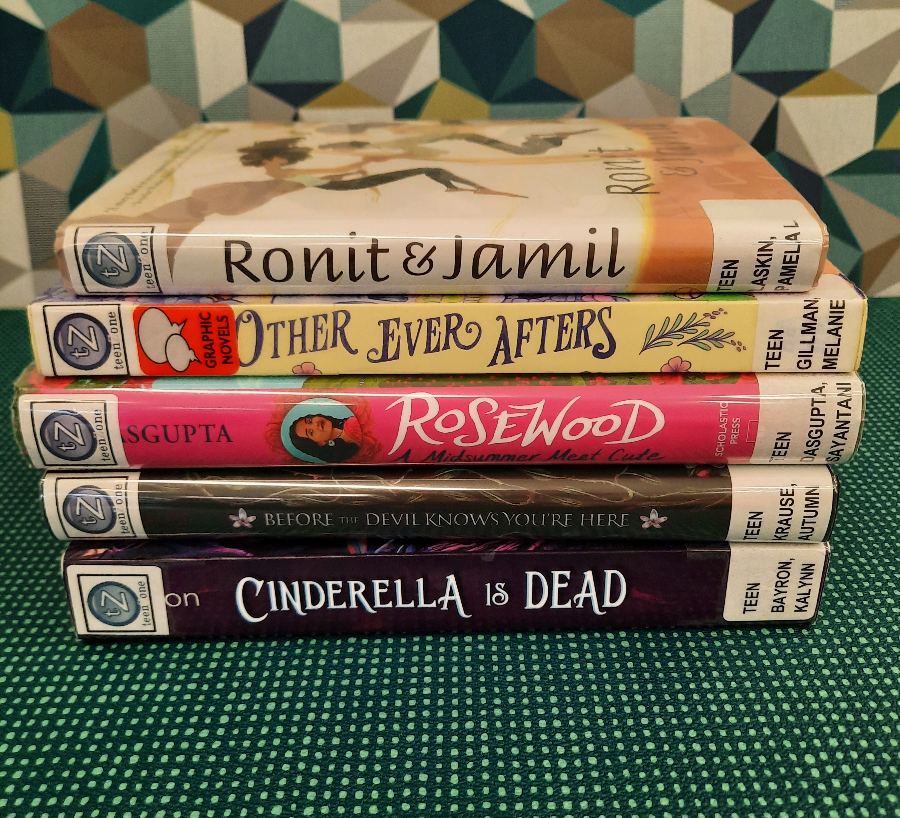 2025 September Book Stack Book stack showing the following titles: "Ronit & Jamil," "Other Ever Afters," "Rosewood: A Midsummer Meet Cute," "Before the Devil Knows You're Here," and "Cinderella is Dead"