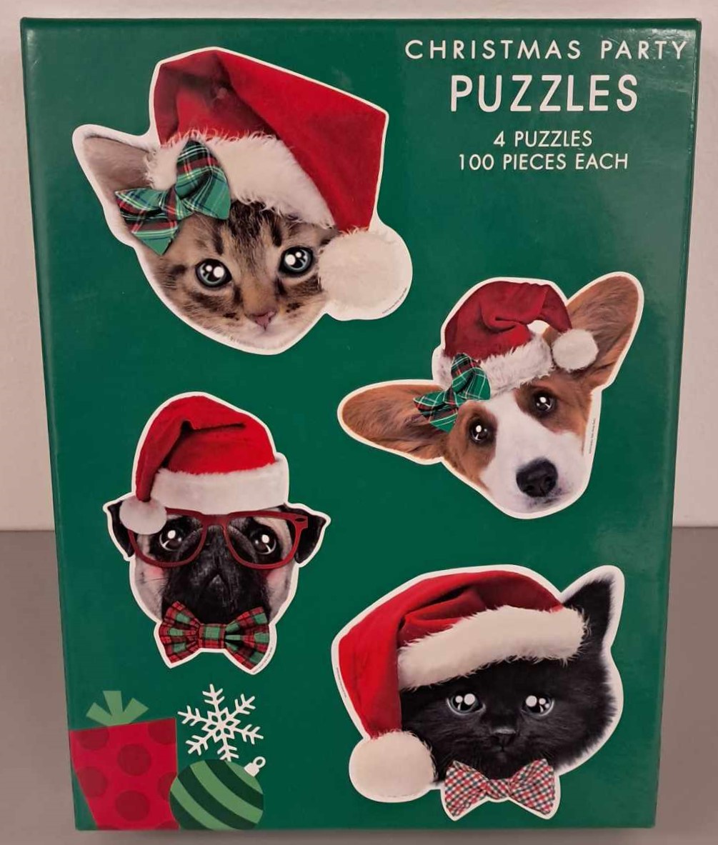 Puzzle cover showing the face of two cats and two dogs wearing Santa hats.