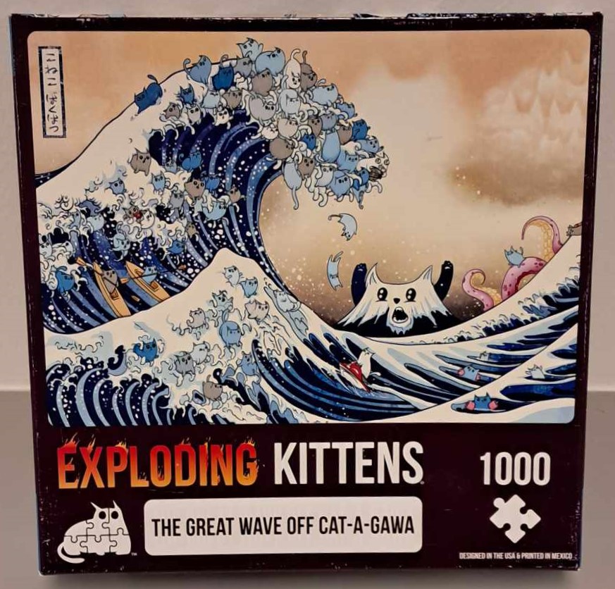 Puzzle cover showing the famous painting the great wave off Kanagawa but it has been changed to show many cats riding the wave.