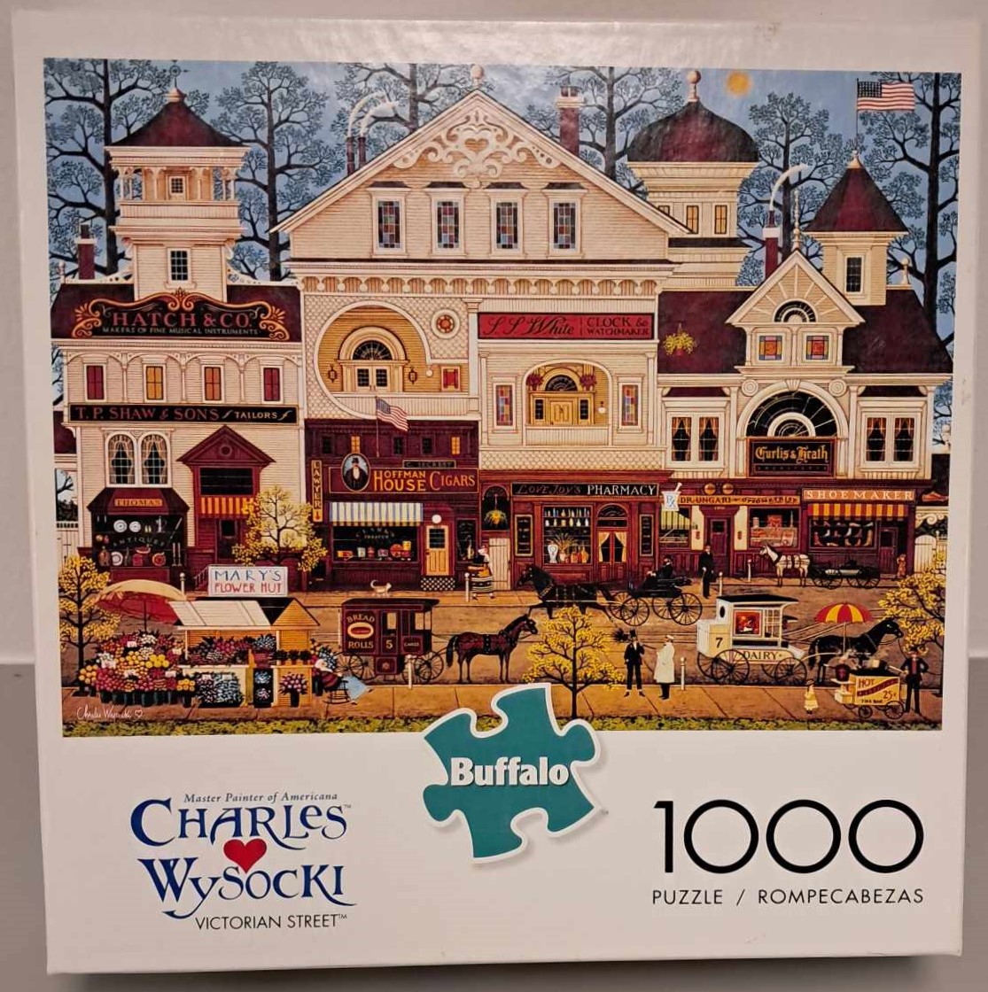 Puzzle cover showing an artistic drawing of a large mansion in the winter.