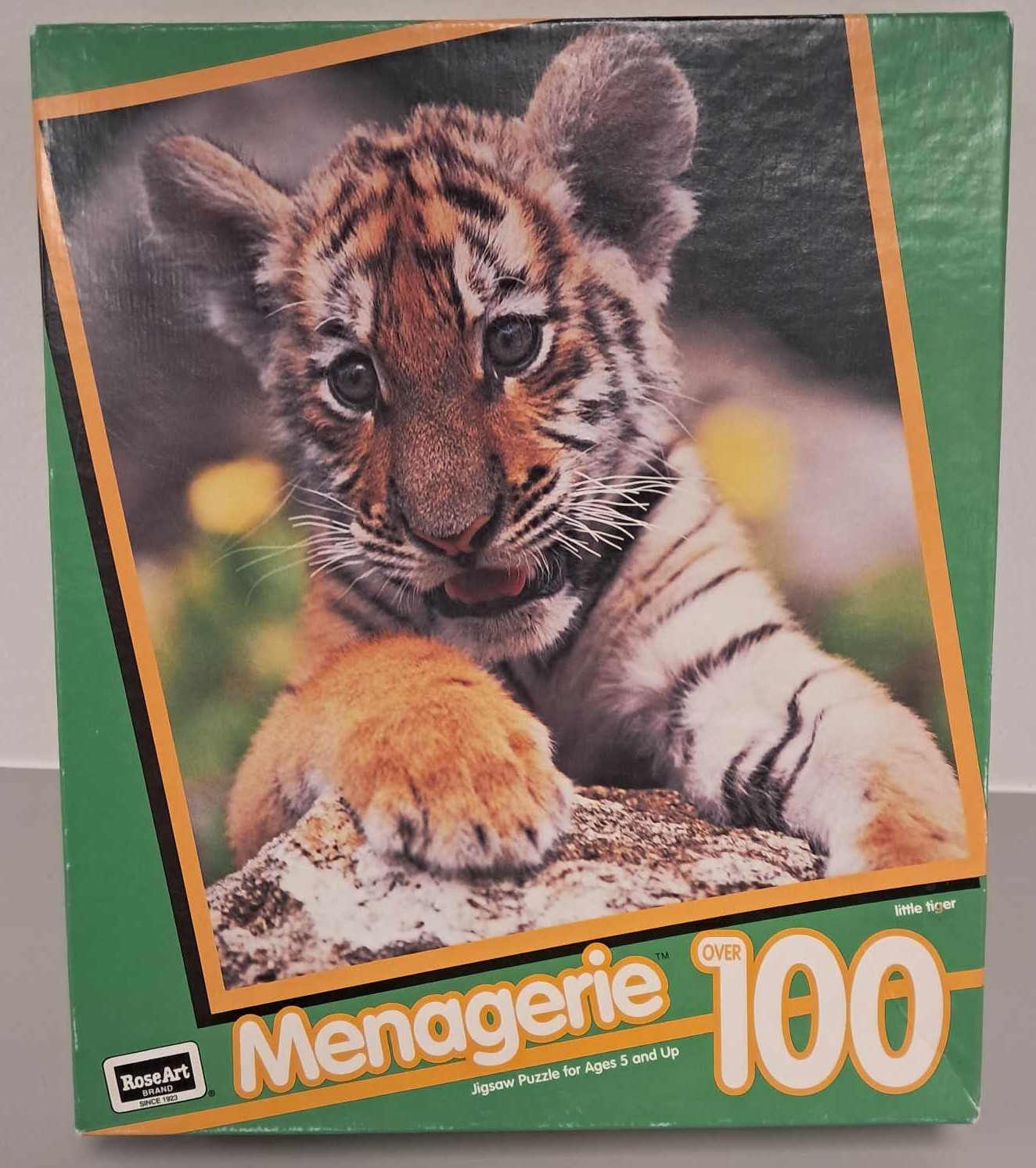 Puzzle cover showing a photo of a tiger cub.