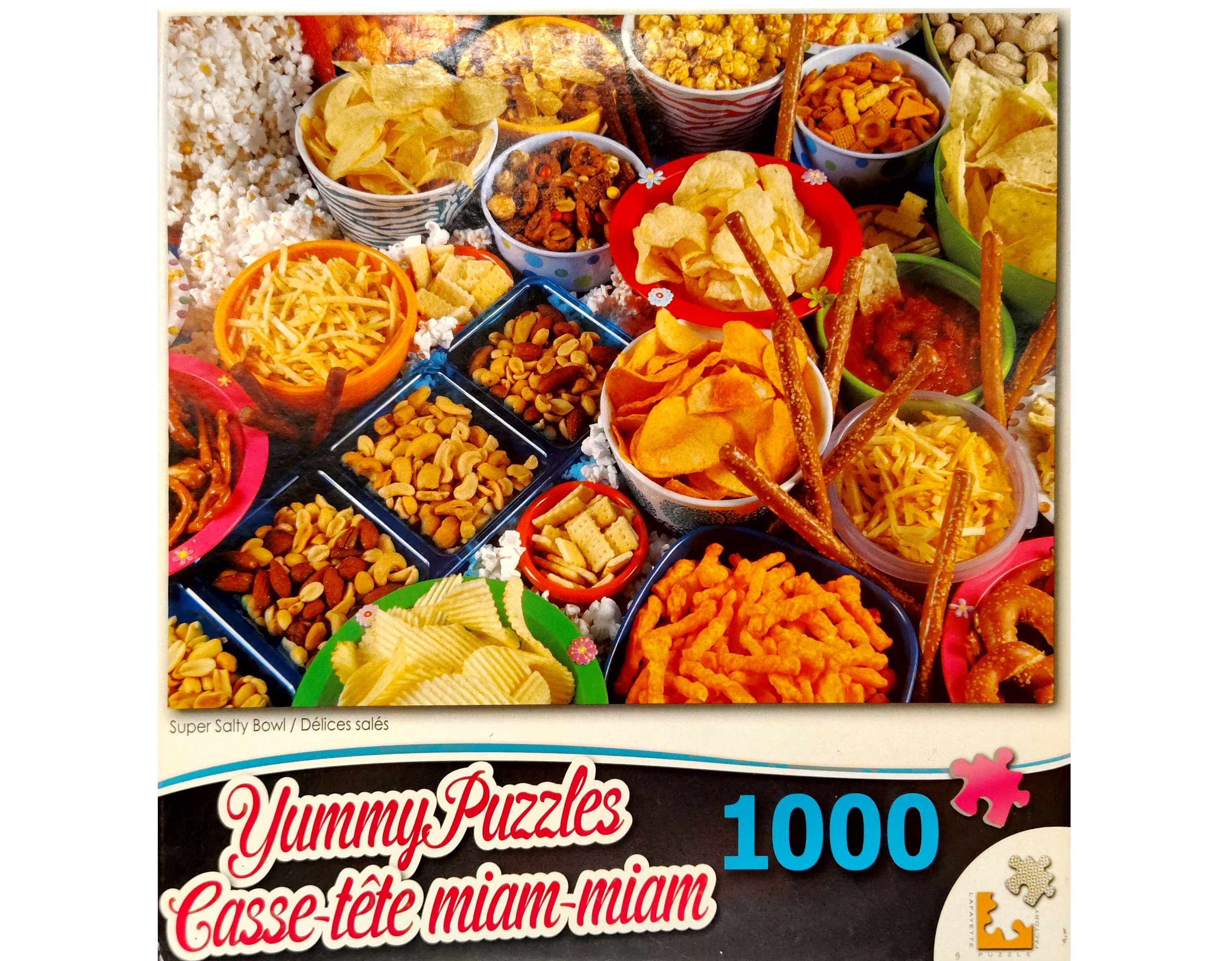 Puzzle cover showing an image of different salty snacks like potato chips, peanuts, pretzels and more.