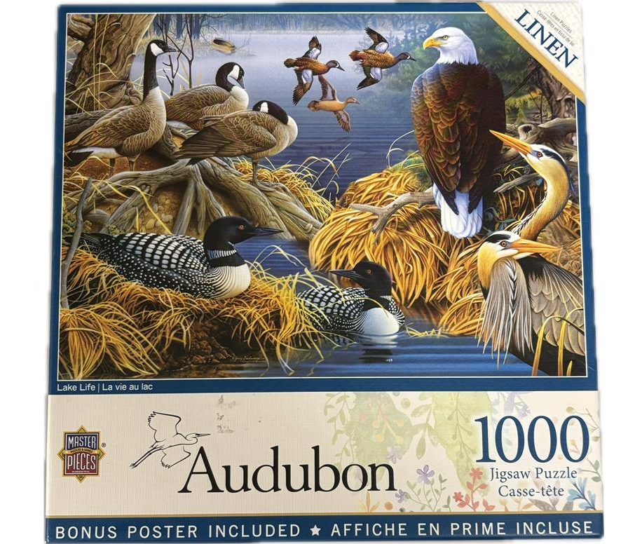 Puzzle cover showing a variety of ducks and 1 bald eagle sitting on the lake.
