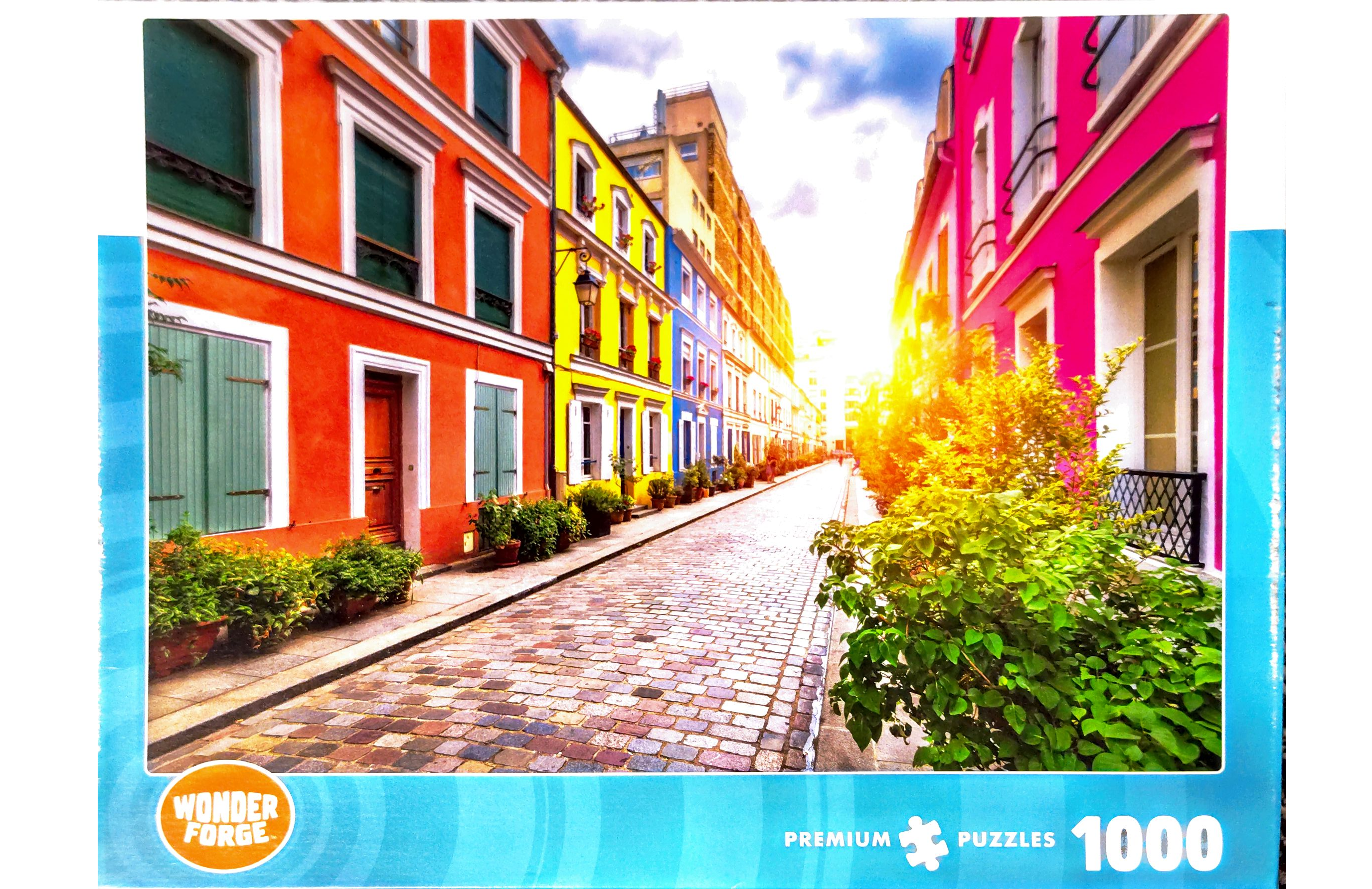 Puzzle cover showing a brick paved street in Paris France.