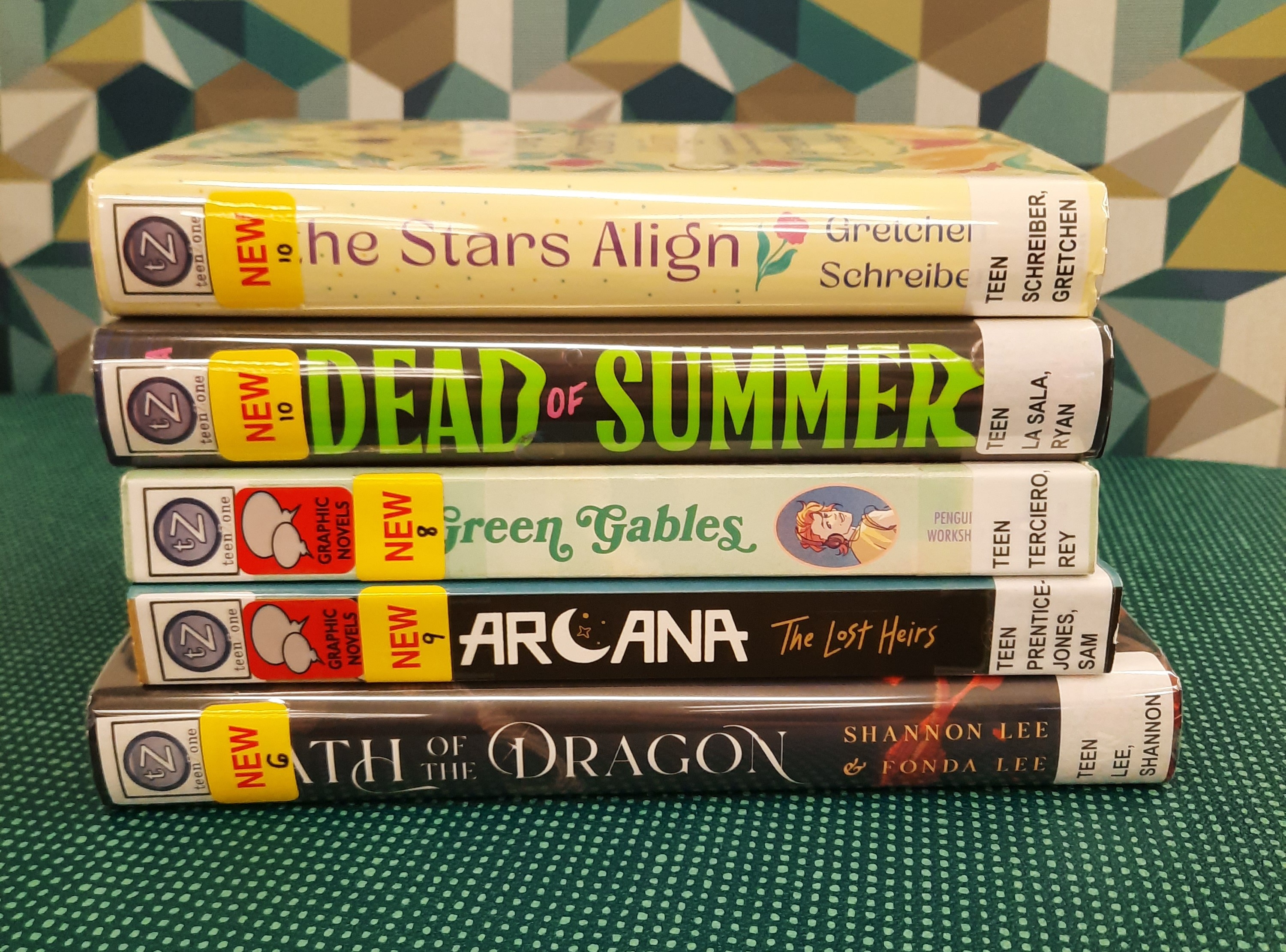 Stack of books that fit the theme of New Books