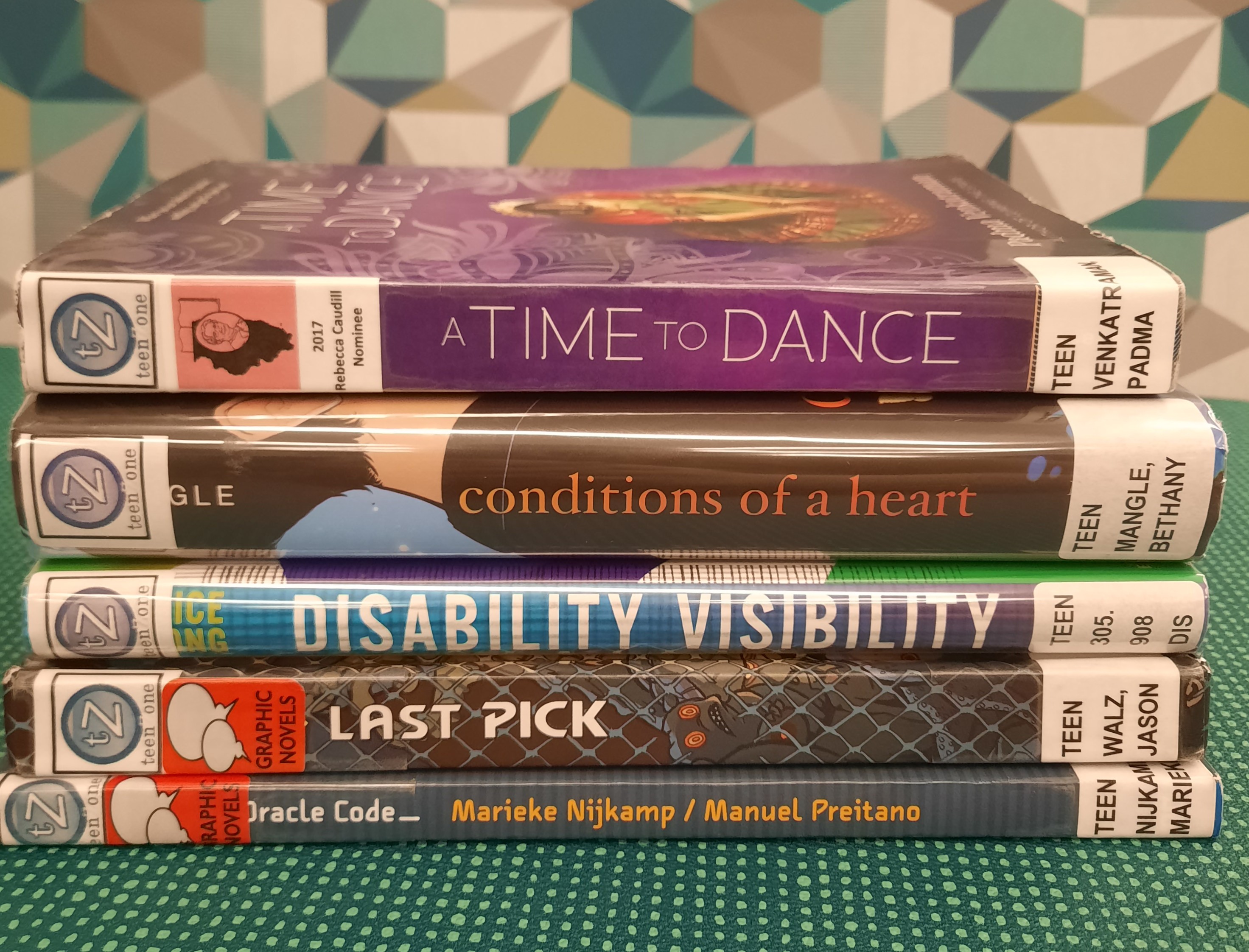Stack of books that fit the theme of Disability Awareness