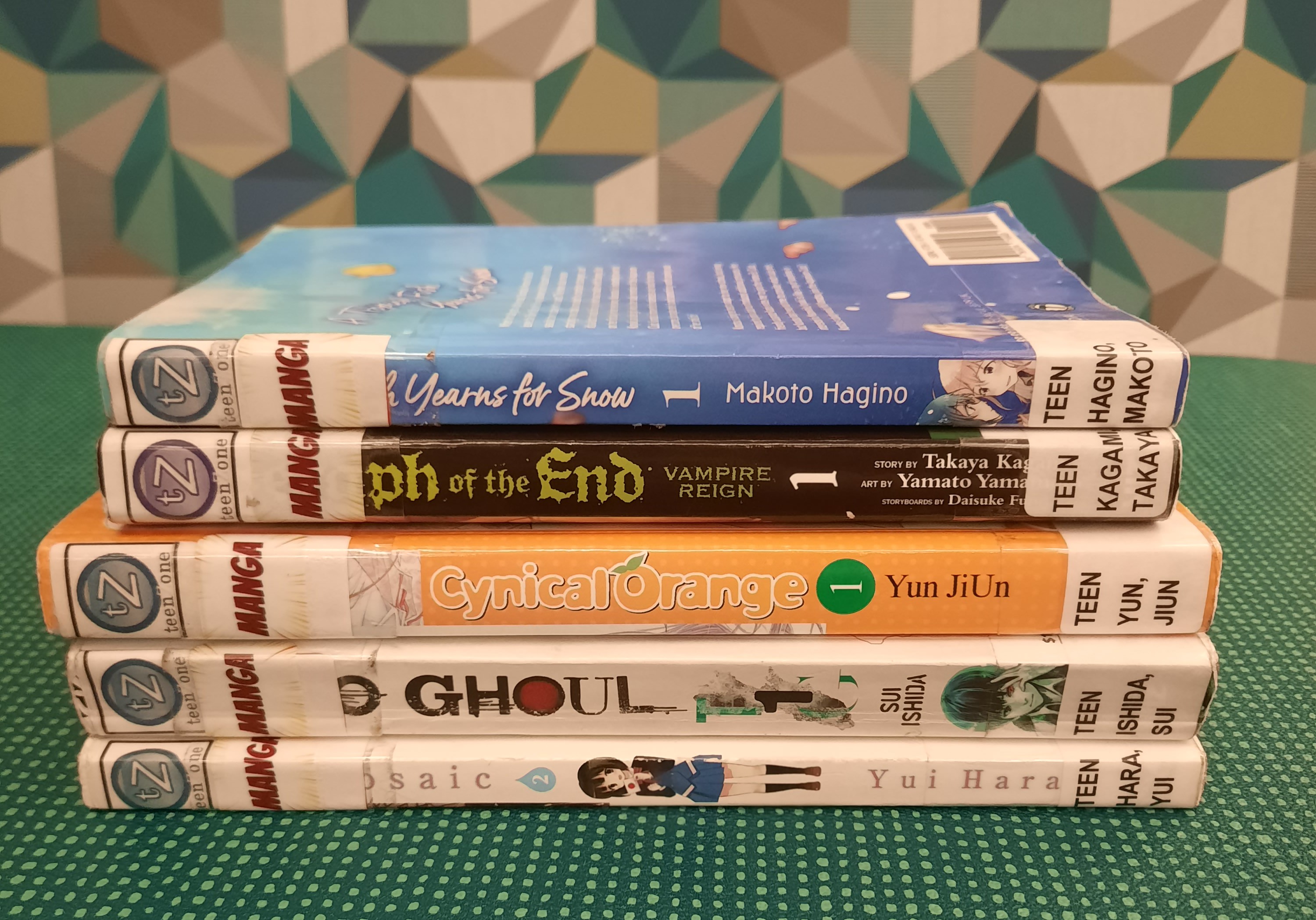 Stack of books that fit the theme of Manga