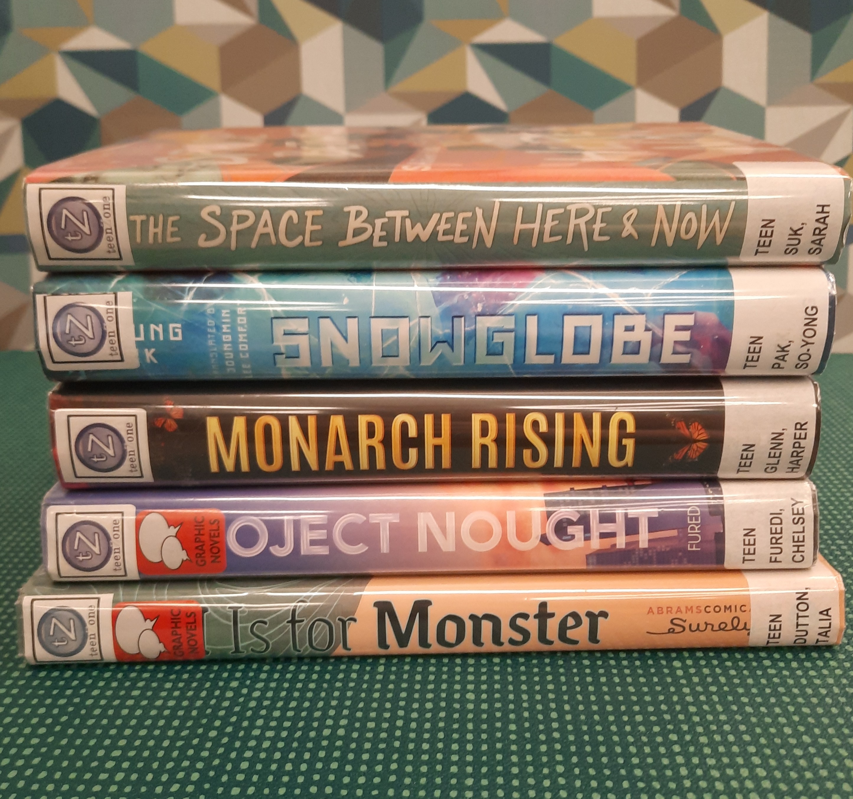 Stack of books that fit the theme of Science Fiction