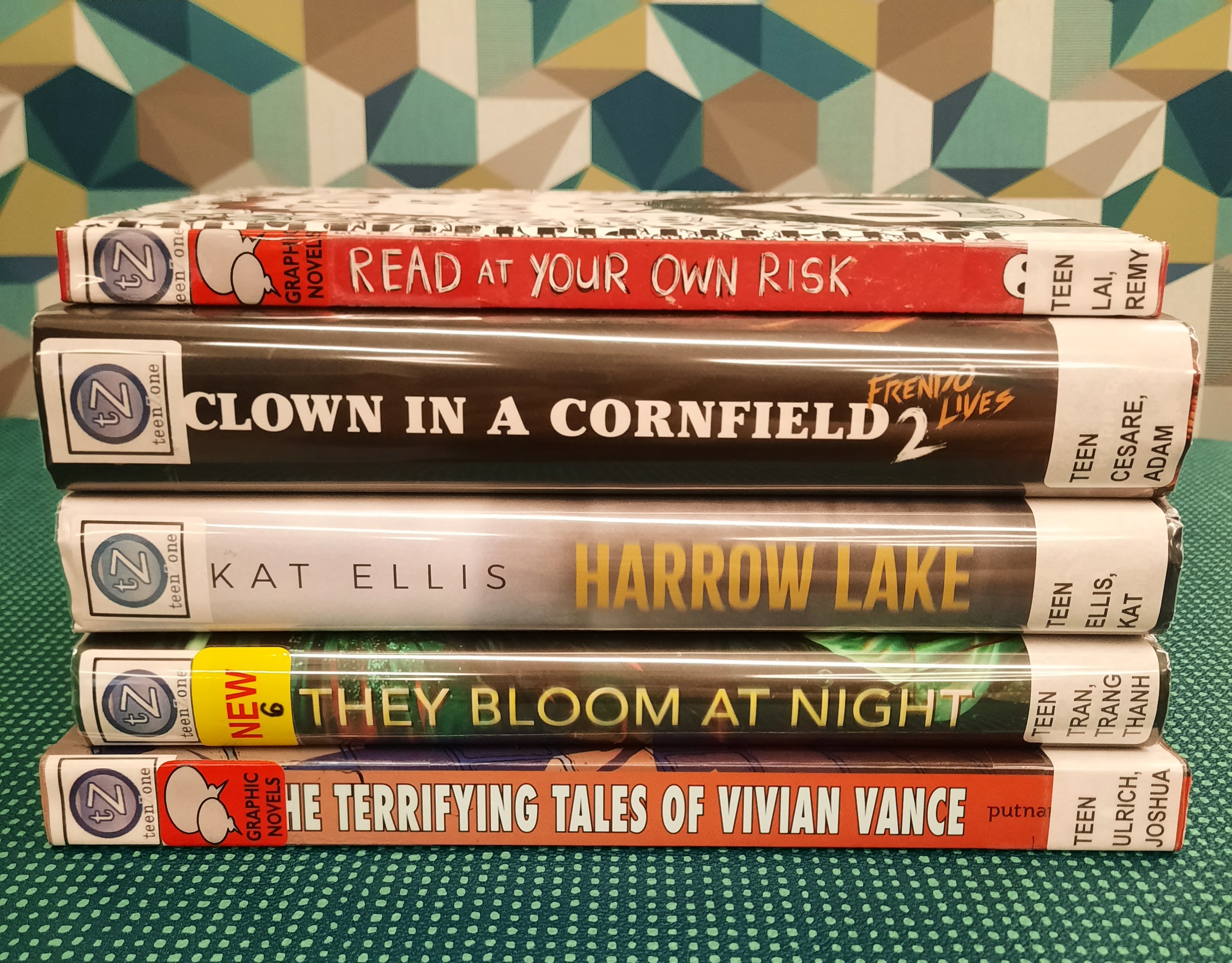 Stack of books that fit the theme of Horror