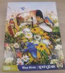 Puzzle Cover with an multiple blue birds in flowers and by a mailbox