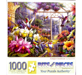 Puzzle cover showing the inside of a green house with many plants and flowers and hummingbirds are flying around.