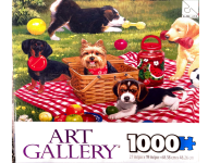 Puzzle cover showing a variety of dogs on a picknick blanket at the park while playing.