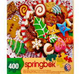 Puzzle cover showing an image of a variety of frosted cookies styled for the Christmas Holiday.
