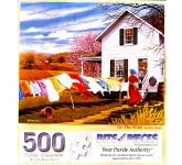Puzzle cover showing a woman hanging clothes on the line while it is windy so the clothes are flowing in the wind.