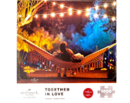 Puzzle cover showing a man and a woman laying together in a hammock.