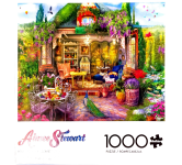 Puzzle cover showing a small building with a chair and table set outdoors and there's a peacock.